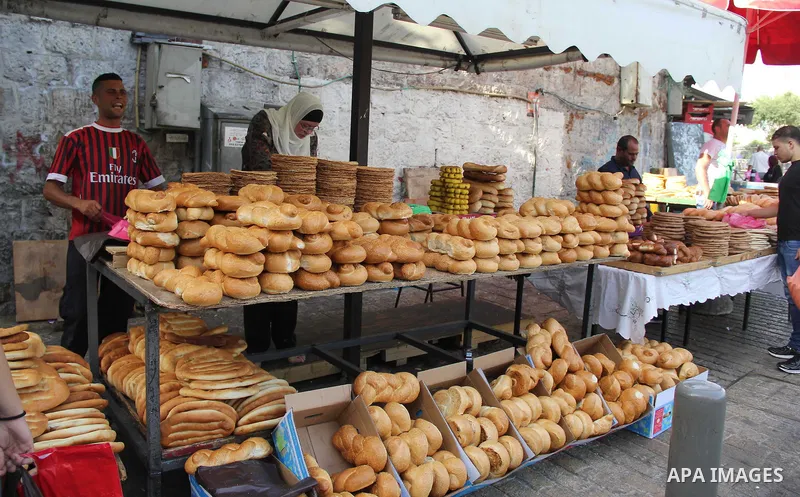 Palestinians shop at a market on the second day of the Ramadan in Jerusalem's old city on June 7, 2016. Ramadan is sacred to Muslims because it is during that month that tradition says the Koran was revealed to the Proph...