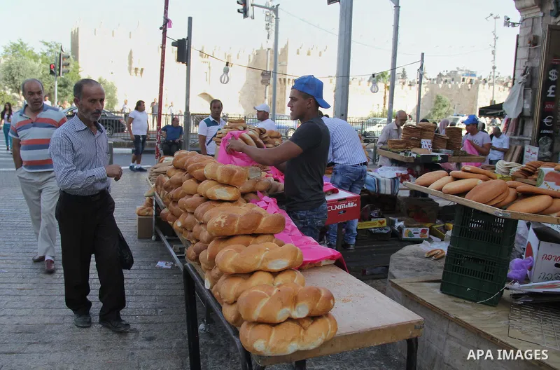 Palestinians shop at a market on the second day of the Ramadan in Jerusalem's old city on June 7, 2016. Ramadan is sacred to Muslims because it is during that month that tradition says the Koran was revealed to the Proph...