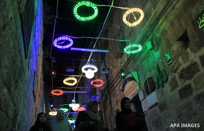 Palestinian Muslim worshippers walk in Jerusalem's Old City, during the holy month of Ramadan June 7, 2016. Photo by Mahfouz Abu Turk