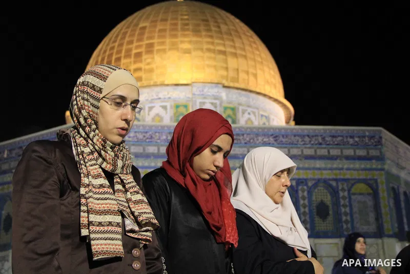 Palestinian Muslim worshippers pray in front of the Dome of the Rock, at the compound known to Muslims as Noble Sanctuary and to Jews as The Temple Mount in Jerusalem's Old City, during the holy month of Ramadan June 7,...