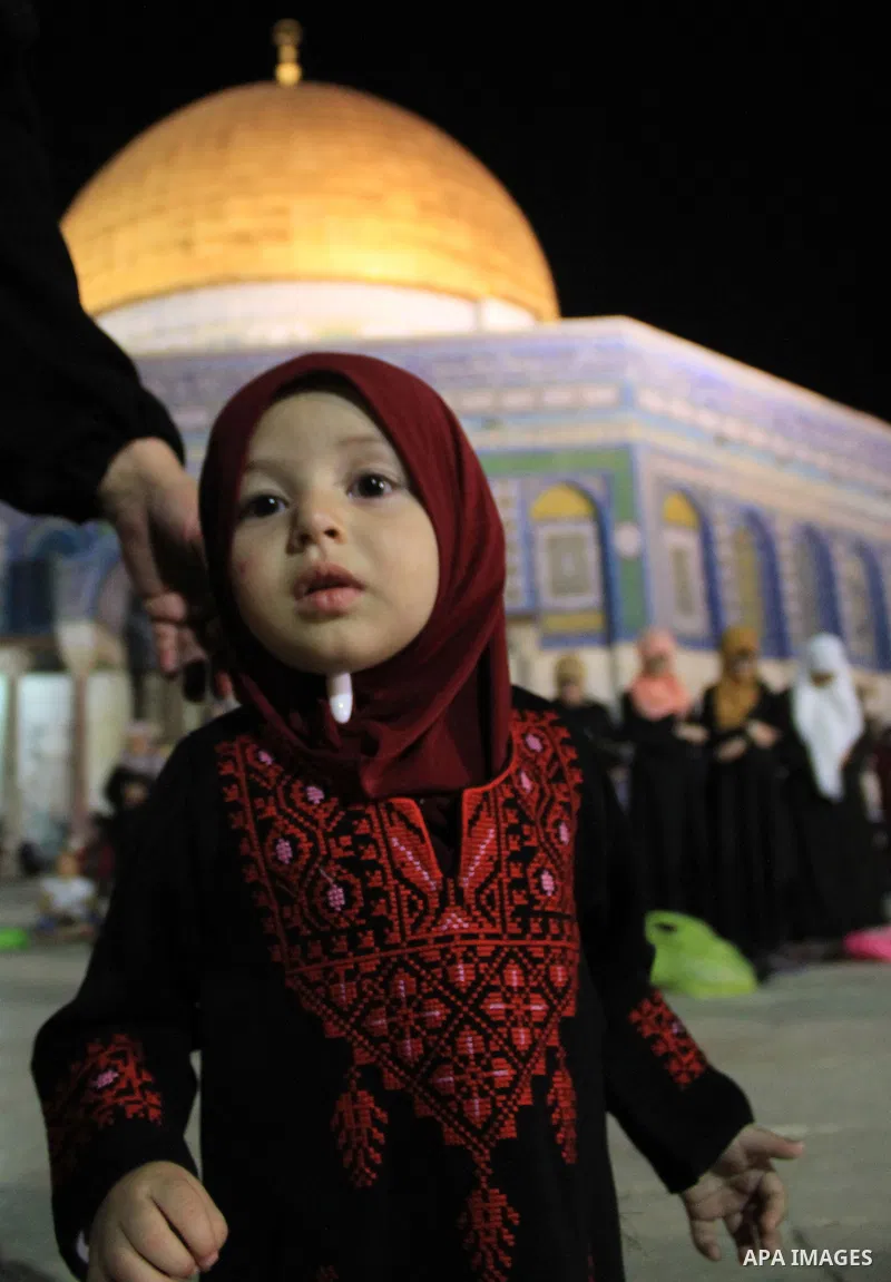 Palestinian Muslim worshippers pray in front of the Dome of the Rock, at the compound known to Muslims as Noble Sanctuary and to Jews as The Temple Mount in Jerusalem's Old City, during the holy month of Ramadan June 7,...