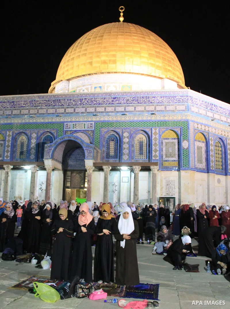 Palestinian Muslim worshippers pray in front of the Dome of the Rock, at the compound known to Muslims as Noble Sanctuary and to Jews as The Temple Mount in Jerusalem's Old City, during the holy month of Ramadan June 7,...