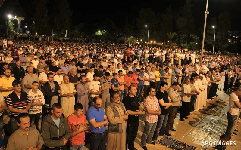 Palestinian Muslim worshippers pray in front of the Dome of the Rock, at the compound known to Muslims as Noble Sanctuary and to Jews as The Temple Mount in Jerusalem's Old City, during the holy month of Ramadan June 7,...