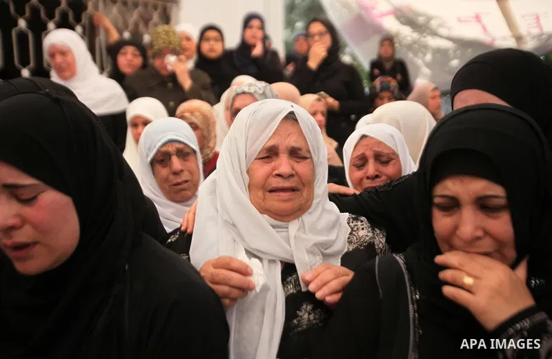 Relatives of Palestinian Jamal Dwikat, who died from wounds he sustained after he was shot during clashes with the Israeli army on Friday, mourn during his funeral in the West Bank village of Balata Albalad near Nablus J...