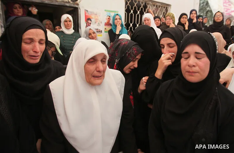 Relatives of Palestinian Jamal Dwikat, who died from wounds he sustained after he was shot during clashes with the Israeli army on Friday, mourn during his funeral in the West Bank village of Balata Albalad near Nablus J...