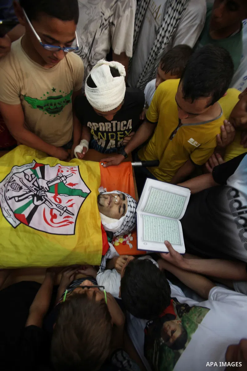 Relatives of Palestinian Jamal Dwikat, who died from wounds he sustained after he was shot during clashes with the Israeli army on Friday, mourn during his funeral in the West Bank village of Balata Albalad near Nablus J...