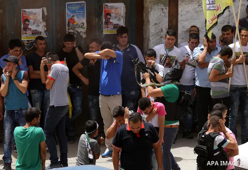 Mourners carry the body of Palestinian Jamal Dwikat, who died from wounds he sustained after he was shot during clashes with the Israeli army on Friday, during his funeral in the West Bank village of Balata Albalad near...