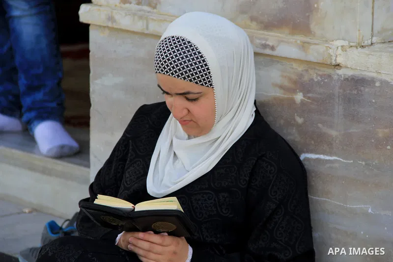 A Palestinian woman reads holy Koran, Islam's holy book, at al-Aqsa mosque, in Jerusalem's old city on June 8, 2016. Ramadan is sacred to Muslims because it is during that month that tradition says the Koran was revealed...