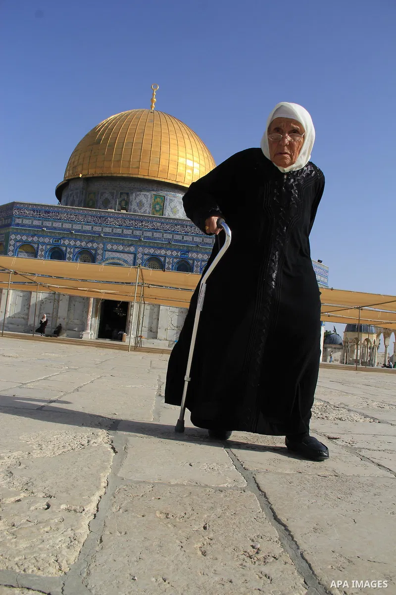 Palestinians Muslims walk walk in front of the Dome of the Rock mosque, in Jerusalem's old city on June 8, 2016. Ramadan is sacred to Muslims because it is during that month that tradition says the Koran was revealed to...