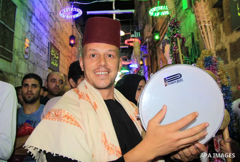 Muslim Sufis play musical instruments as they parade through the streets during the holy month of Ramadan in Jerusalem's old city, 08 June 2015. Ramadan is sacred to Muslims because it is during that month that tradition...