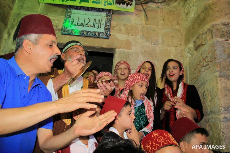 Muslim Sufis play musical instruments as they parade through the streets during the holy month of Ramadan in Jerusalem's old city, 08 June 2015. Ramadan is sacred to Muslims because it is during that month that tradition...