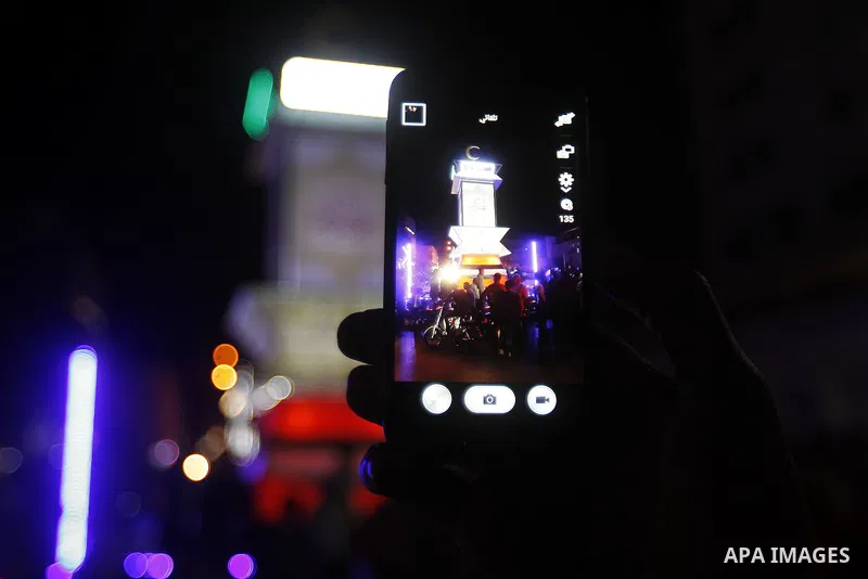 Palestinians take part in a ceremony of lighting Ramadan a traditional lantern known in Arabic as "Fanous", on the holy month of Ramadan in the West bank city of Hebron on June 08, 2016. Ramadan is sacred to Muslims beca...
