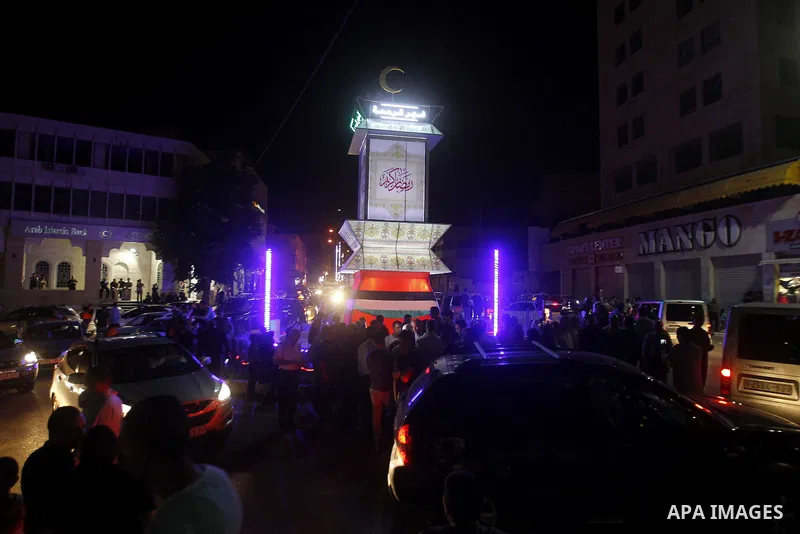 Palestinians take part in a ceremony of lighting Ramadan a traditional lantern known in Arabic as "Fanous", on the holy month of Ramadan in the West bank city of Hebron on June 08, 2016. Ramadan is sacred to Muslims beca...