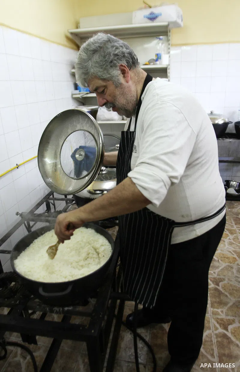 A Palestinian man prepares food for the poor Palestinians from an Islamic charity "Tekkia" in the West Bank city of Nablus on the holy month of Ramadan on June 09, 2016. Ramadan is sacred to Muslims because it is during...