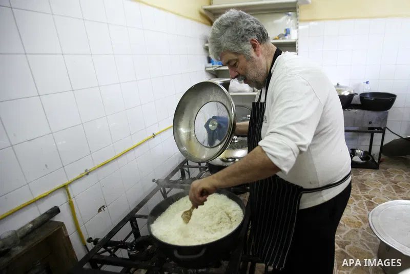 A Palestinian man prepares food for the poor Palestinians from an Islamic charity "Tekkia" in the West Bank city of Nablus on the holy month of Ramadan on June 09, 2016. Ramadan is sacred to Muslims because it is during...