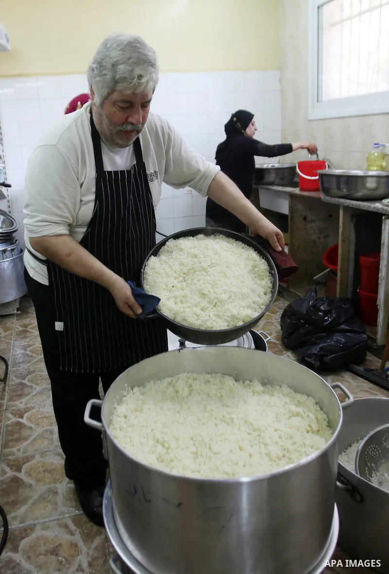 A Palestinian man prepares food for the poor Palestinians from an Islamic charity "Tekkia" in the West Bank city of Nablus on the holy month of Ramadan on June 09, 2016. Ramadan is sacred to Muslims because it is during...