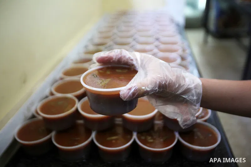 A Palestinian man prepares food for the poor Palestinians from an Islamic charity "Tekkia" in the West Bank city of Nablus on the holy month of Ramadan on June 09, 2016. Ramadan is sacred to Muslims because it is during...