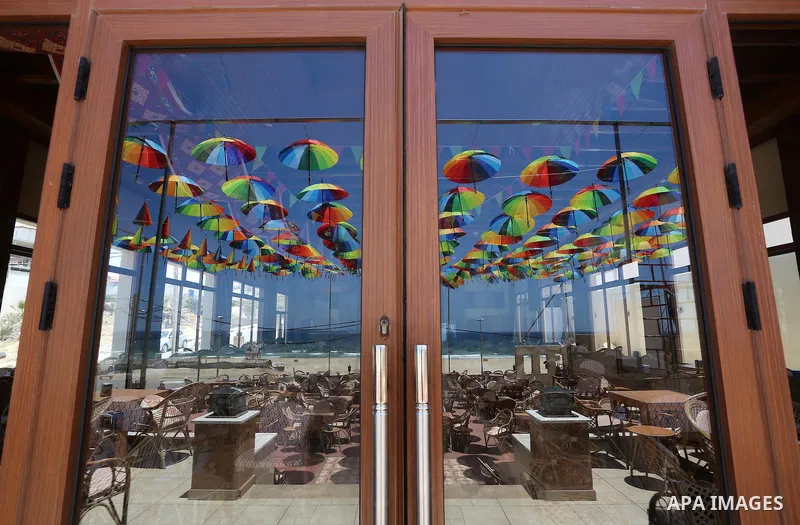 A Picture taken in June 9, 2016 shows beachside café shop was decorate its terrace with hanging colourful umbrellas as part of decorations for the Muslim holy fasting month of Ramadan in Gaza City. Ramadan is sacred to M...