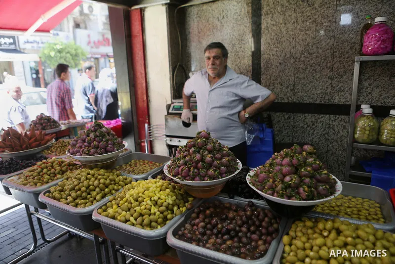 A Palestinian vendor sells pickles at a market on the holy month of Ramadan in the West bank city of Ramallah, on June 09, 2016. Ramadan is sacred to Muslims because it is during that month that tradition says the Koran...