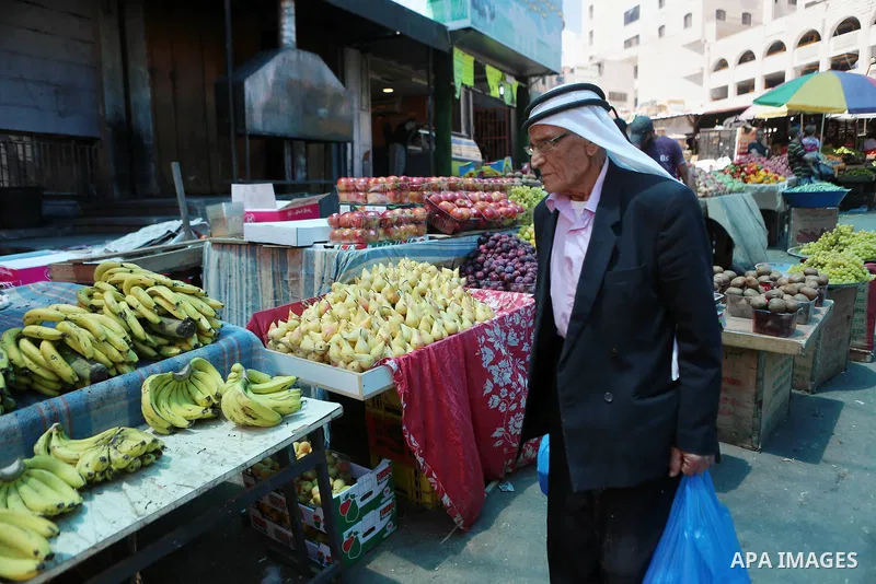 A Palestinian vendor sells fruits at a market on the holy month of Ramadan in the West bank city of Ramallah, on June 09, 2016. Ramadan is sacred to Muslims because it is during that month that tradition says the Koran w...