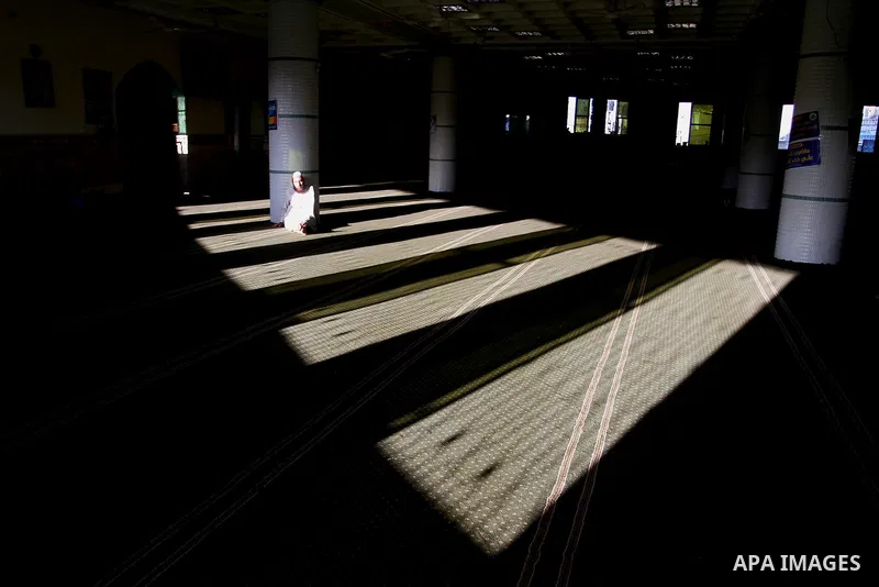 A Palestinian boy reads the holy Koran, Islam's holy book, at a Mosque during the Muslim holy fasting month of Ramadan in Rafah in the southern Gaza strip, on June 9, 2016. Photo by Abed Rahim Khatib