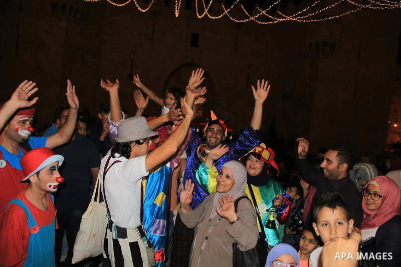 Palestinians celebrate during the holy month of Ramadan in Jerusalem's old city, on June 9, 2016. Ramadan is sacred to Muslims because it is during that month that tradition says the Koran was revealed to the Prophet Moh...
