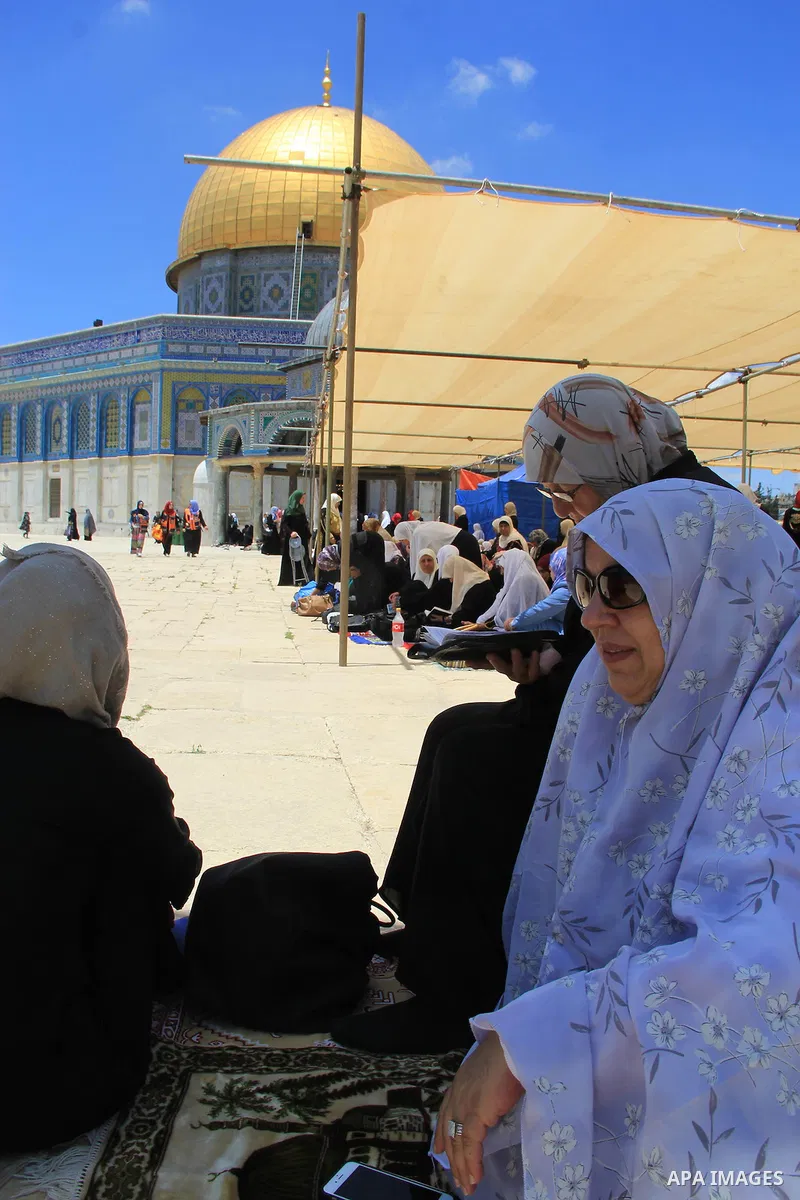 Palestinians pray in front of the Dome of the Rock at Jerusalem's Al-Asqa mosque compound during the first Friday prayers of the holy Muslim fasting month of Ramadan on June 10, 2016. Praying at the site, the third-holie...