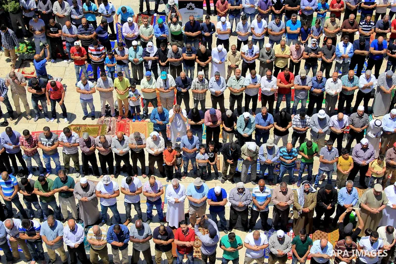 Palestinians pray in front of the Dome of the Rock at Jerusalem's Al-Asqa mosque compound during the first Friday prayers of the holy Muslim fasting month of Ramadan on June 10, 2016. Praying at the site, the third-holie...