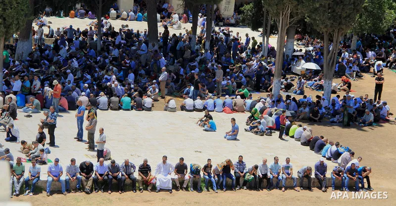 Palestinians pray in front of the Dome of the Rock at Jerusalem's Al-Asqa mosque compound during the first Friday prayers of the holy Muslim fasting month of Ramadan on June 10, 2016. Praying at the site, the third-holie...