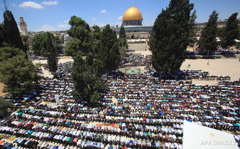 Palestinians pray in front of the Dome of the Rock at Jerusalem's Al-Asqa mosque compound during the first Friday prayers of the holy Muslim fasting month of Ramadan on June 10, 2016. Praying at the site, the third-holie...