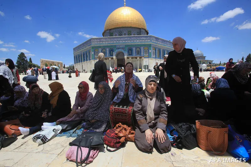 Palestinians pray in front of the Dome of the Rock at Jerusalem's Al-Asqa mosque compound during the first Friday prayers of the holy Muslim fasting month of Ramadan on June 10, 2016. Praying at the site, the third-holie...