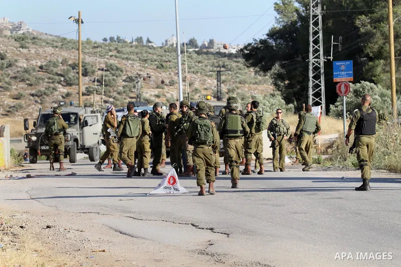 Israeli security forces stand at a checkpoint near the West Bank city of Nablus, June 10, 2016, after a Palestinian man attempted a stabbing attack. Palestinian was shot and wounded, army said. Photo by Nedal Eshtayah
