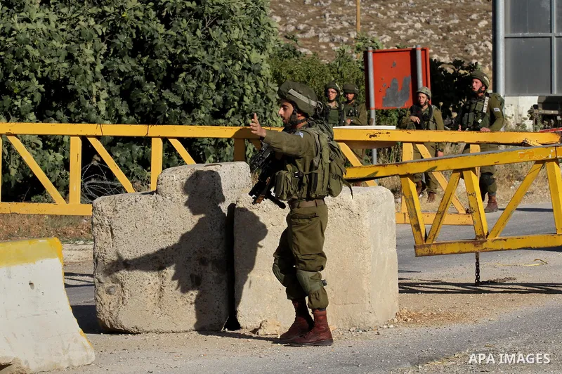 Israeli security forces stand at a checkpoint near the West Bank city of Nablus, June 10, 2016, after a Palestinian man attempted a stabbing attack. Palestinian was shot and wounded, army said. Photo by Nedal Eshtayah