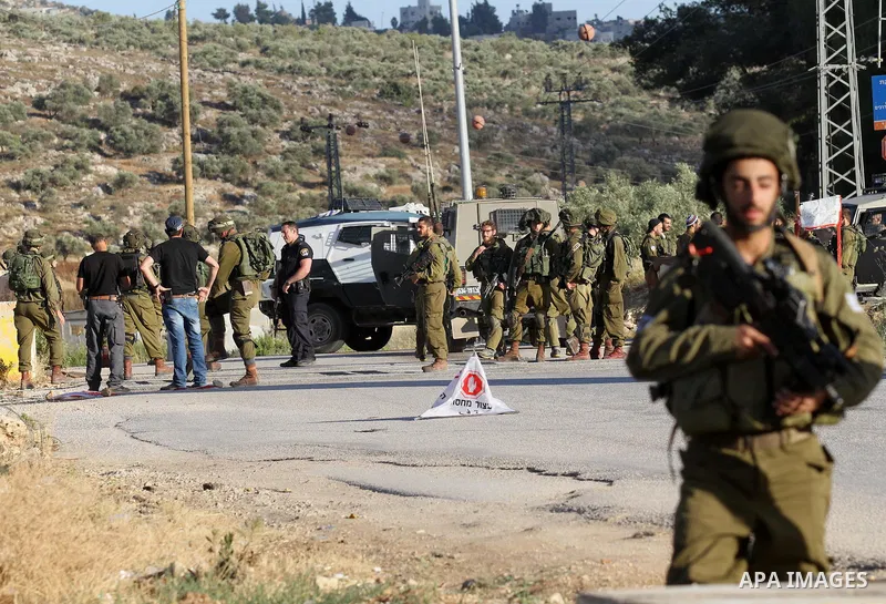 Israeli security forces stand at a checkpoint near the West Bank city of Nablus, June 10, 2016, after a Palestinian man attempted a stabbing attack. Palestinian was shot and wounded, army said. Photo by Nedal Eshtayah