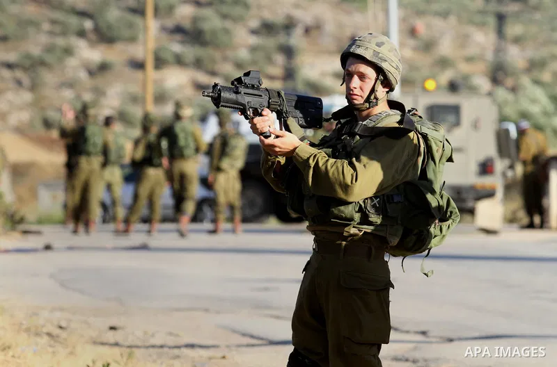 Israeli security forces stand at a checkpoint near the West Bank city of Nablus, June 10, 2016, after a Palestinian man attempted a stabbing attack. Palestinian was shot and wounded, army said. Photo by Nedal Eshtayah