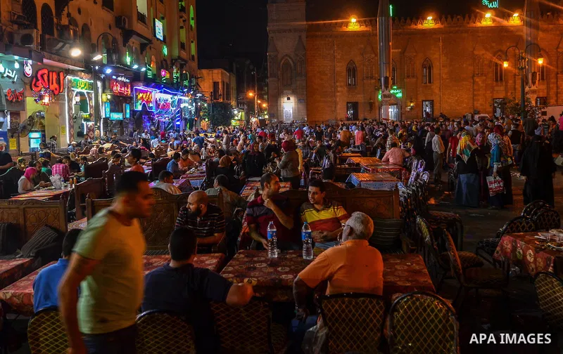 Egyptian Muslims eat their Iftar meal as they break their fast around the garden of Al-Hussein mosque during the holy fasting month of Ramadan, in the old Islamic area of Cairo, Egypt, on June 10, 2016. Ramadan is sacred...