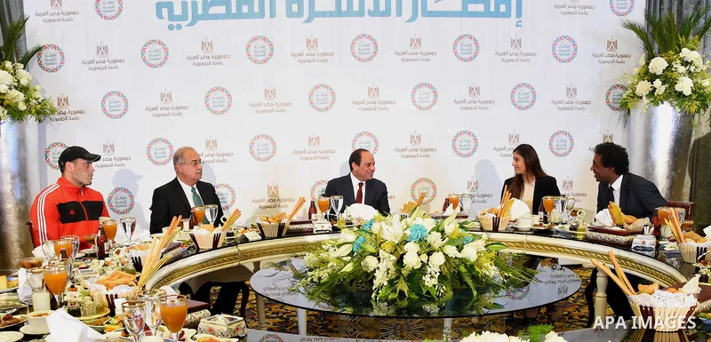 Egyptian President Abdel-Fattah al-Sisi takes part in the Egyptian family breakfast, as he celebrates the Muslim holy month of Ramadan, in Cairo, on June 11, 2016. Photo by Egyptian President Office