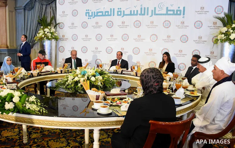 Egyptian President Abdel-Fattah al-Sisi takes part in the Egyptian family breakfast, as he celebrates the Muslim holy month of Ramadan, in Cairo, on June 11, 2016. Photo by Egyptian President Office