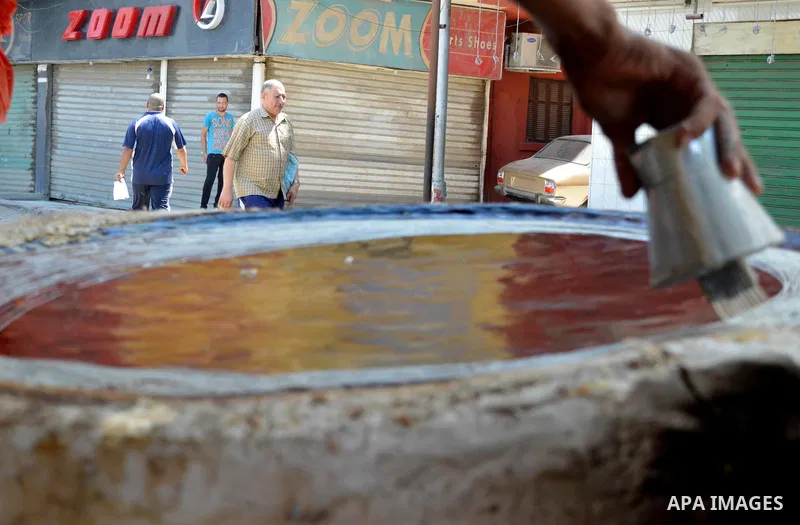 An Egyptian man prepares a traditional sweets "Konafa" on the holy month of Ramadan, in Cairo, Egypt, on June 12, 2016. Ramadan is sacred to Muslims because it is during that month that tradition says the Koran was revea...