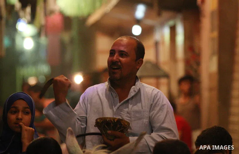 An Egyptian dawn awakener "al-Musaharati" ride a donkey through streets to wake up Muslims for a meal before sunrise during the fasting month of Ramadan, in Cairo, Egypt, on June 13, 2016. Al-Musaharati is an old profess...
