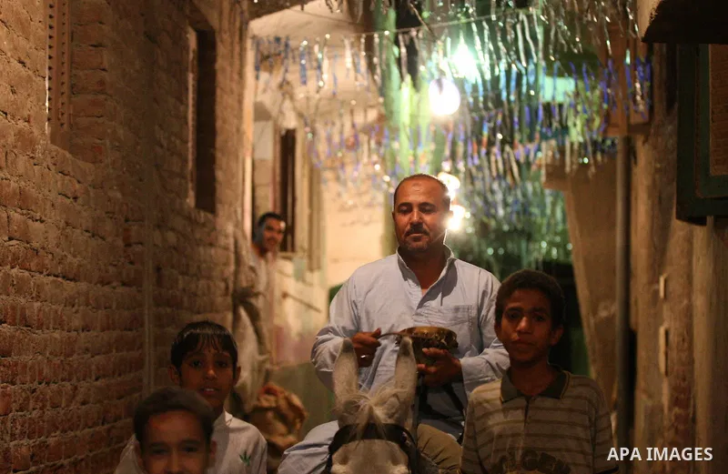 An Egyptian dawn awakener "al-Musaharati" ride a donkey through streets to wake up Muslims for a meal before sunrise during the fasting month of Ramadan, in Cairo, Egypt, on June 13, 2016. Al-Musaharati is an old profess...