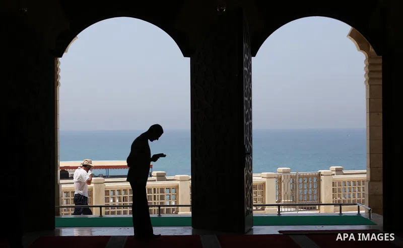 A Palestinian man sits reading the Koran, Islam's holy book, at the al-Khaldi mosque during the Muslim fasting month of Ramadan, in Gaza City on June 13, 2016. Photo by Mohammed Asad
