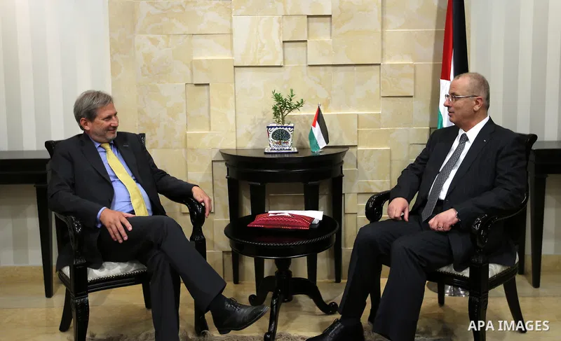 Palestinian Prime Minister Rami Hamdallah meets with European Union Commissioner designate for Regional Policy Johannes Hahn, in the West Bank city of Ramallah, on June 14, 2016. Photo by Prime Minister Office