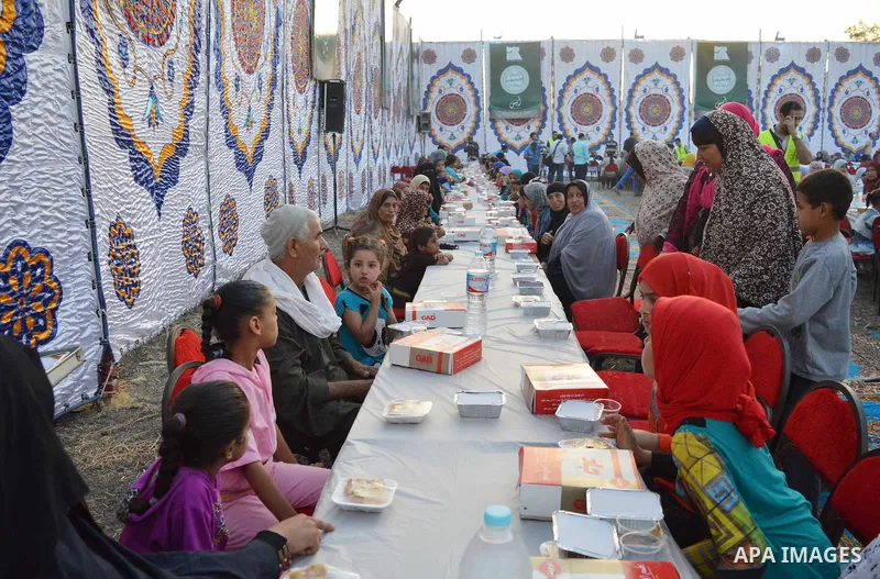 Egyptian Muslims eat their Iftar meal as they break their fast during the holy fasting month of Ramadan, in Alexandria, Egypt, on June 14, 2016. Ramadan is sacred to Muslims because it is during that month that tradition...