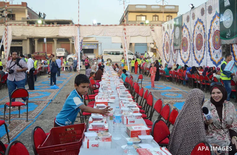 Egyptian Muslims eat their Iftar meal as they break their fast during the holy fasting month of Ramadan, in Alexandria, Egypt, on June 14, 2016. Ramadan is sacred to Muslims because it is during that month that tradition...
