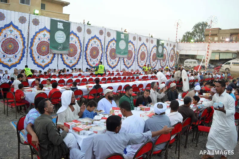 Egyptian Muslims eat their Iftar meal as they break their fast during the holy fasting month of Ramadan, in Alexandria, Egypt, on June 14, 2016. Ramadan is sacred to Muslims because it is during that month that tradition...