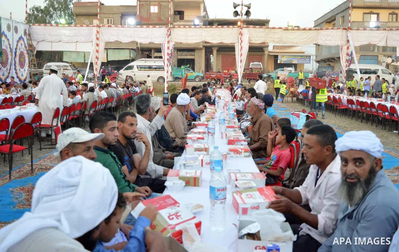 Egyptian Muslims eat their Iftar meal as they break their fast during the holy fasting month of Ramadan, in Alexandria, Egypt, on June 14, 2016. Ramadan is sacred to Muslims because it is during that month that tradition...