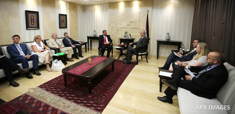 Palestinian Prime Minister Rami Hamdallah meets with Michael Collier, charge of official cooperation between the European Union and neighboring countries, in the West Bank city of Ramallah, on June 15, 2016. Photo by Pri...