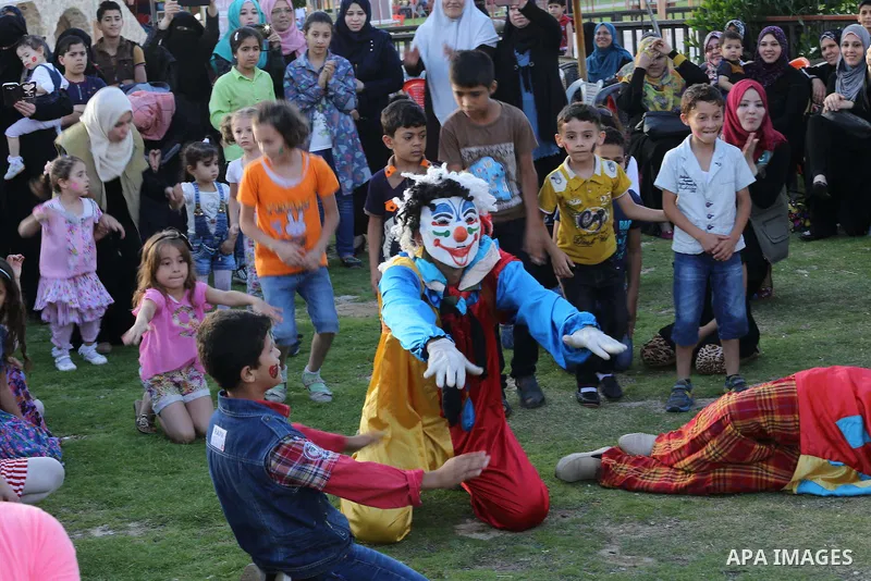 Palestinian children play as they wait to break their daytime fast, during the Muslim holy month of Ramadan, in Gaza city on June 15, 2016. Ramadan is sacred to Muslims because it is during that month that tradition says...