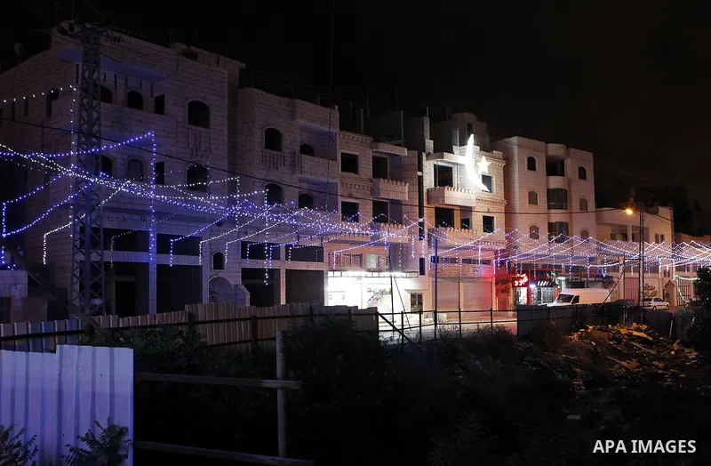 Lighting decorations are seen at a street during the holy fasting month of Ramadan in the West Bank city of Hebron, June 16, 2016. Muslims around the world celebrate Ramadan, the holy month in the Islamic calendar, in wh...